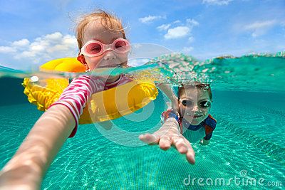 Swimmer training with a safety buoy in the pool